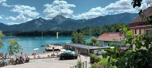 a view of a lake and a dock with a boat at Appartement Kärntner Seenland in Ledenitzen