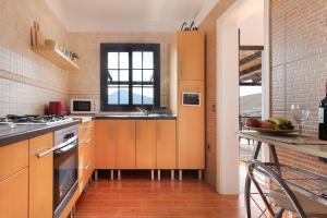 a kitchen with orange cabinets and a window at Casa Tagaide in Tuineje +19 photos