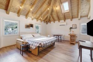 a bedroom with a bed and a table at Ca' Vittorio in Rossiglione