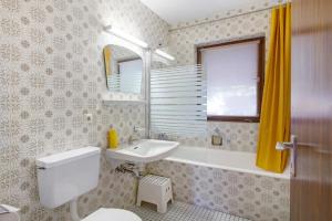 a bathroom with a white toilet and a sink at Haus vor Anker in Feldberg +23 photos