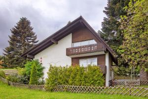 a small house with a balcony on top of it at Haus vor Anker in Feldberg