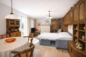 a bedroom with a bed and a table in a room at Ferienwohnung Hinterthal in Hinterthal