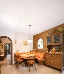 a living room with a couch and a table at Ferienwohnung Hinterthal in Hinterthal +4 photos