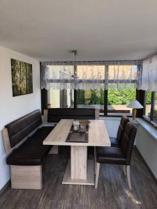 a living room with a table and two chairs at Ferienwohnung Strey in Rosenow