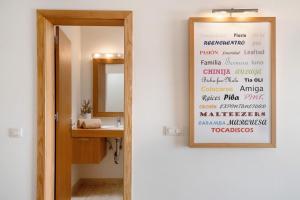 a bathroom with a mirror and a sink at Welling in Punta Mujeres