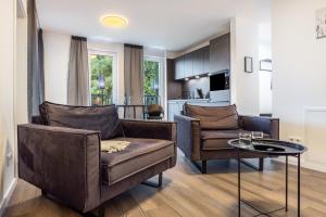a living room with a couch and a table at Egge Resort 7g mit Whirpool u Sauna in Altenbeken