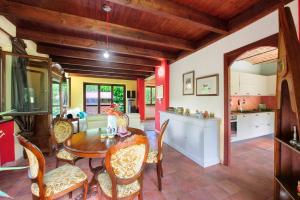 a kitchen and dining room with a table and chairs at Il Trucchetto - Castagneto Po in Chivasso
