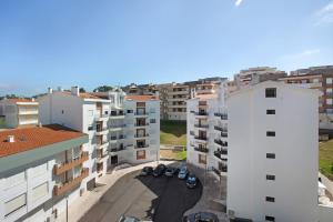 an aerial view of a city with buildings at T0 Grota in Buarcos