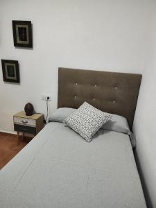 a bedroom with a bed with a pillow on it at Marina Golf in Mojácar