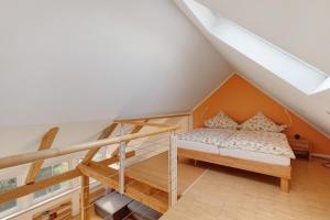 a bedroom with a bunk bed and a ladder at Birkethof Romantik-Appartement in Mickhausen