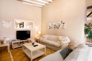 a living room with a couch and a tv at Saint Maxime in Adeje