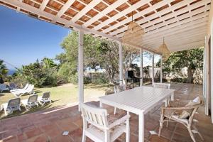 a white table and chairs on a patio at Saint Maxime in Adeje