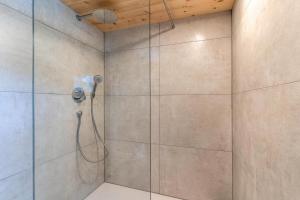 a bathroom with a shower with a glass door at Im Rosengarten 3 in Zell am Harmersbach +13 photos