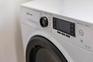 a white washer and dryer in a room at Im Rosengarten 3 in Zell am Harmersbach
