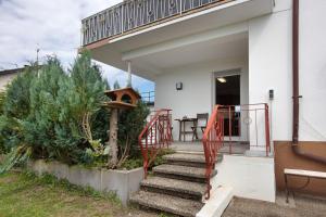 a staircase leading to a house with a balcony at Familie Quednow - Im Algi in Görwihl