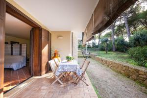 a table and chairs on the patio of a house at Casa Cenate Due in Nardò