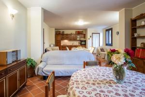 a living room with two tables and a bedroom at Casa Cenate Due in Nardò
