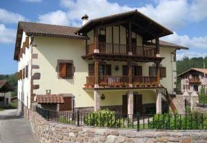 a large house with a porch and a balcony at Matxingonea 2 in Urdax