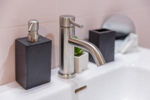 a bathroom sink with a faucet and other objects at Matxingonea 2 in Urdax +21 photos