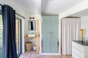 a bathroom with a glass shower and a sink at Dune Lodge 2- Capbreton Hossegor - in Capbreton +23 photos