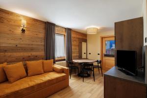 a living room with a couch and a table at Villa Elma - Livigno in Livigno