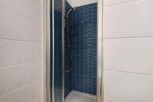 a shower with a glass door in a bathroom at Casa mare montaretto 1 in Bonassola +18 photos