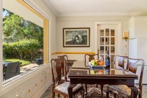 a table with a bowl of fruit on a balcony at Villa Echium T1 in Caniço +20 photos