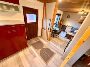 a room with a kitchen and a living room at Alte Schmiede in Melzow