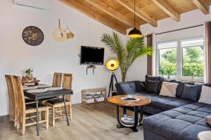 a living room with a couch and a table at Urlaub im Garten Gottes in Klosterlangheim