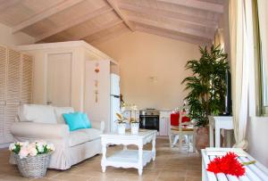 a living room with a couch and a table at Villa Kochilaki Ideales Resort in Kefallonia