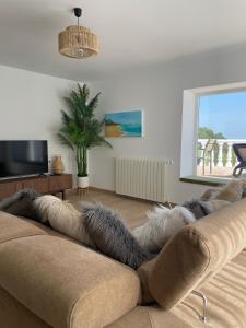 a living room with a couch covered in fur at Villa Gracia in Mijas