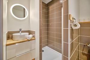 a bathroom with a sink and a shower at Duplex Sauna privé Vénosc Le 1618 in Les Deux Alpes +25 photos