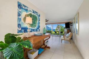 a living room with a table and a couch at Ocean Bluff Gem in Princeville Beach Access Pool in Princeville