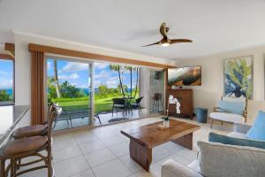 a living room with a couch and a table at Ocean Bluff Gem in Princeville Beach Access Pool in Princeville