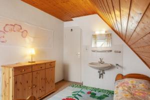 a small bathroom with a sink and a sink at Ferienwohnung Schloss-See-Bergblick in Waldeck +48 photos