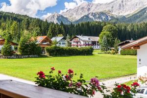 a view of a village with mountains in the background at Landhaus Sonja 1 in Leutasch
