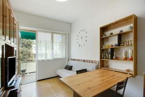 a living room with a table and a couch at Casa Dica in Rapallo