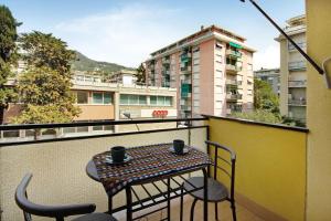 a balcony with a table and chairs on a balcony at Casa Dica in Rapallo