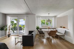 a living room with a table and chairs and a dining room at Ferienwohnung Frieda in Frickingen