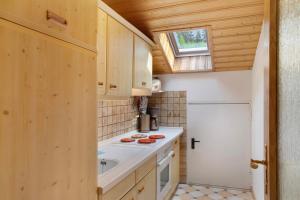 a small kitchen with a sink and a stove at Ferienwohnung Frieder in Grainau