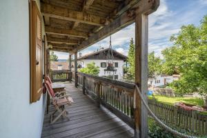 a porch with a hammock and a swing at Bergchalet Fuchsberger in Verano