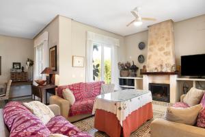a living room with couches and a fireplace at Sol, playa y diversion en Roche in Roche