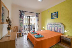 a bedroom with a bed and a balcony at Bosque São José Ag in Olhos de Água +17 photos