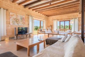 a living room with a couch and a tv at Son Coranta in Campos