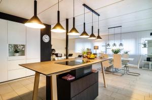 a kitchen with a wooden counter top in a room at Turmalin in Überlingen
