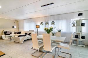 a living room with a table and a couch at Turmalin in Überlingen
