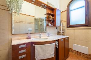 a bathroom with a sink and a mirror at Tenuta del Normanno in Carovigno +27 photos