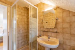 a bathroom with a sink and a shower at La résidence du vieux four in Saint-Geniès +17 photos