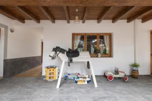 a ladder in a room with toys and a window at Pensión las 3 Golondrinas in Santa Eularia des Riu