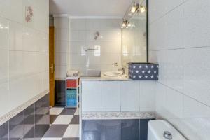 a bathroom with a tub and a sink and a toilet at La cargolera in L'Escala +16 photos